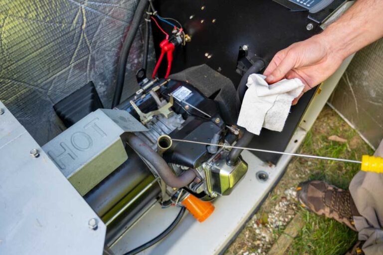 E I Electrical technician servicing a home generator