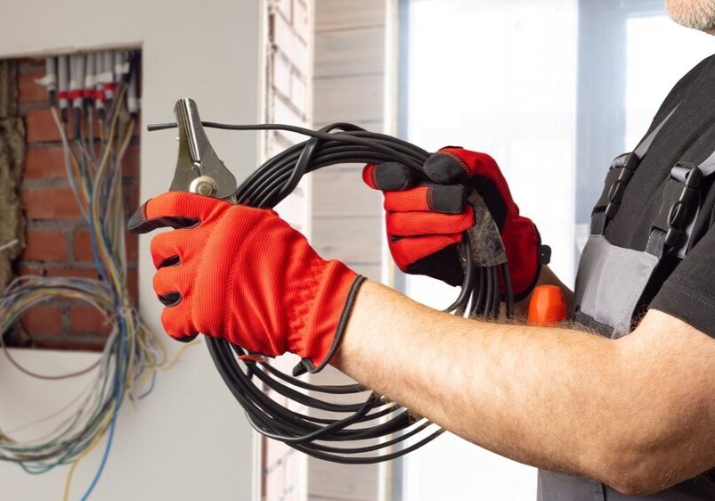 electrician installing electrical wiring