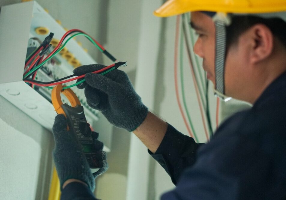 electrician testing electrical panel