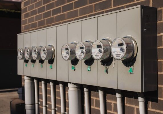 row of outdoor electric meters on building