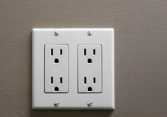 white double electrical outlet on wall
